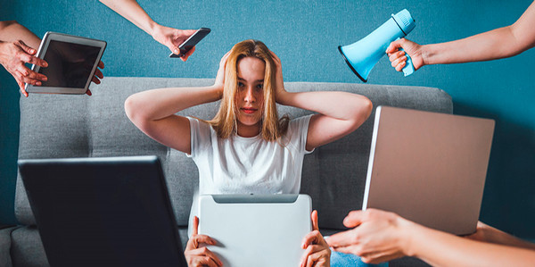 stressed woman with things happening around her